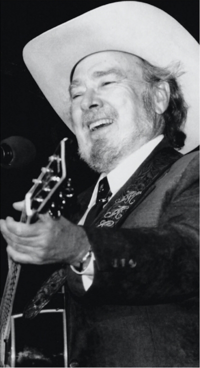Malcolm B “Mac” Wiseman dubbed “The Voice with a Heart” has recorded over 800 songs and was instrumental in the founding of the Country Music Association. He was born May 23, 1925, in Crimora, Va. As an infant he contracted polio and spent much of this childhood indoors listening to old country records on the family’s phonograph. After deciding to pursue a career in music, he attended the Shenandoah Conservatory of Music in Virginia with help from the National Foundation for infantile Paralysis, which would later become the March of Dimes. In 1946, Wiseman joined Molly O’ Day’s band, where he developed a love of classic country. In 1948, he joined Lester Flatt and Scruggs as a member of their Foggy Mountain Boys. In 1949, he joined Bill Monroe’s Bluegrass Boys where he played the Grand Ole Opry for the first time. In 1949 he left the band for a solo career. In 1951, Mac released his first single, “Tis Sweet to be Remembered” which became a career-making song. He then went on to record other classics, including “Ballad of Davy Crockett.” Mac was inducted into the Bluegrass Hall of Fame in 1993. In 2014 he was inducted into Country Music of Hall of Fame in Nashville.