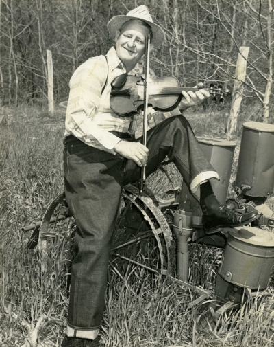 Born near Weaverville, North Carolina in 1898, Joseph Emmett Mainer learned to play the banjo when he was about nine years old. In 1923 J. E.’s brother Wade joined him in Concord and the two of them began playing around for dances and shows. They went to work for the Crazy Water Crystal Company broadcasting over WBT in Charlotte as J. E. Mainer's Crazy Mountaineers. The group soon played at many other radio stations. RCA Victor decided to record the group in 1935 for their Bluebird label. J. E. got Snuffy Jenkins in 1937 to play banjo for him. Some of the Mainer recordings with Snuffy Jenkins' three-finger picking sound tantalizingly close to what would later be called bluegrass. His recordings in 1946 resulted in several singles and two albums. An enduring original from these sessions was "Run Mountain”. In 1962, Chris Strachwitz of the Arhoolie label visited J. E. in Concord and subsequently cut a new album, “The Legendary Family from the Blue Ridge Mountains”. Beginning in 1967, J. E. cut a series of 20 albums for Uncle Jim O’Neal’s Rural Rhythm label, guested on the WWVA Jamboree and played numerous festivals. Two re-issues on Strachwitz’s Old Timey label of early material, along with J. E.’s album from 1946 and a pair of albums that J. E. put out helped keep his earlier material in print. J. E. Mainer stayed active in music until his death in 1971.